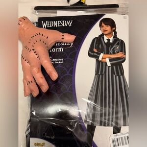 Wednesday inspired costume. Throwing in hand & bangs.